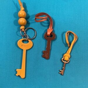 Fossil Yellow and Brown Keychain Hang Tags